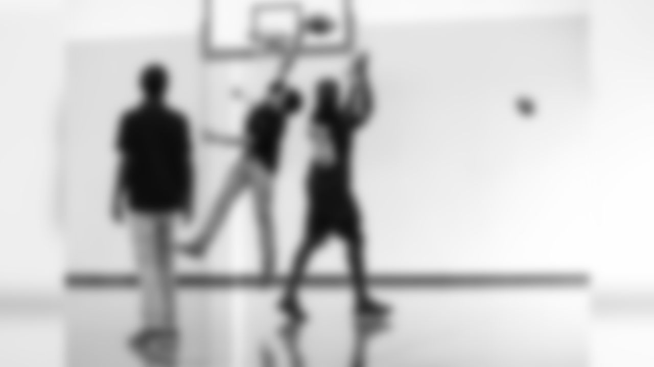 An image from the Sept. 25, 2018 community development event in which Sammie Coates Jr. and Julien Davenport played basketball and ate pizza with local students.