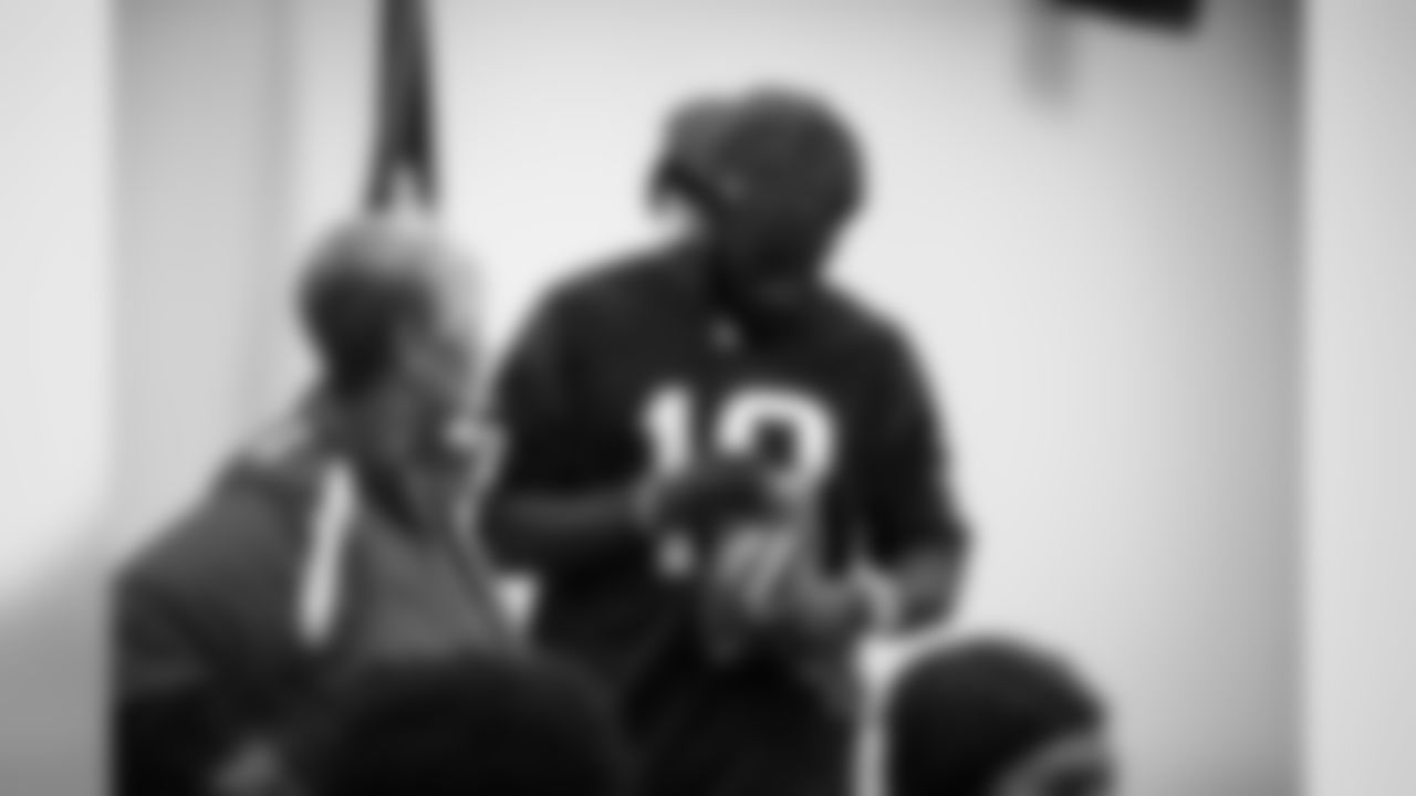 An image from the Sept. 25, 2018 community development event in which Sammie Coates Jr. and Julien Davenport played basketball and ate pizza with local students.
