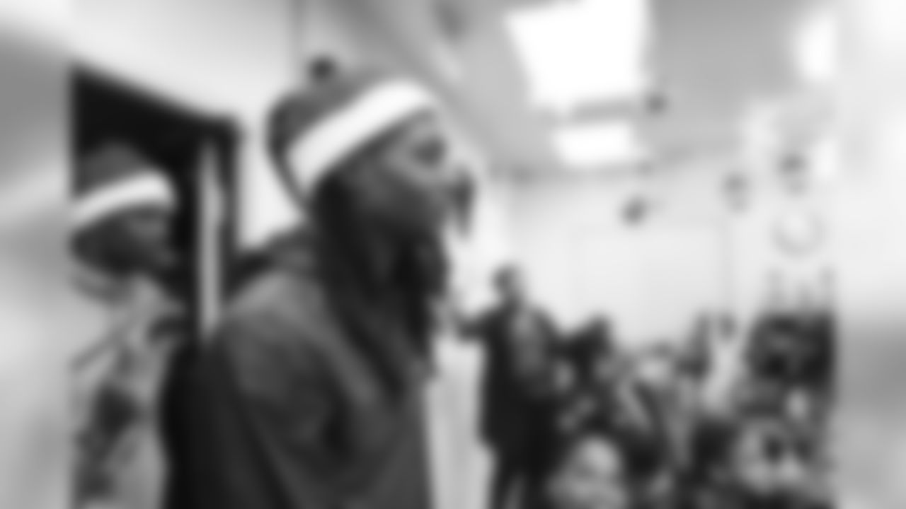 An image from the Dec. 21, 2018 community development event at the Madge Bush Transitional Living Center. Andre Johnson and DeAndre Hopkins gave gifts to families.