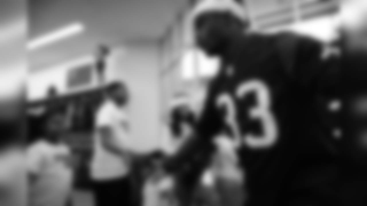 An image from a Dec. 18, 2018 community development event in which Texans rookie players shopped for Christmas gifts with Texans YMCA students.