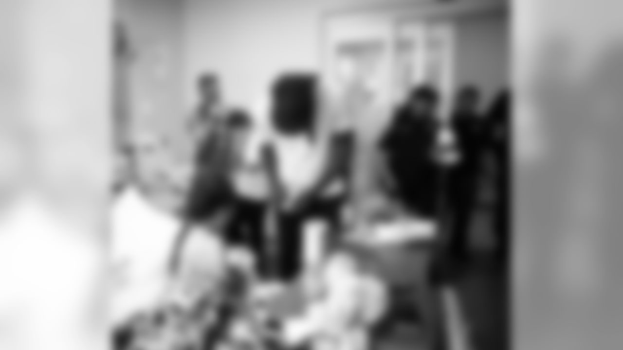 An image from the Oct. 30, 2018 community development event at Texas Children's Hospital. Players and police officers visited with hospital patients and making them honorary Òpolice officers for the dayÓ, gifting them with teddy bears.