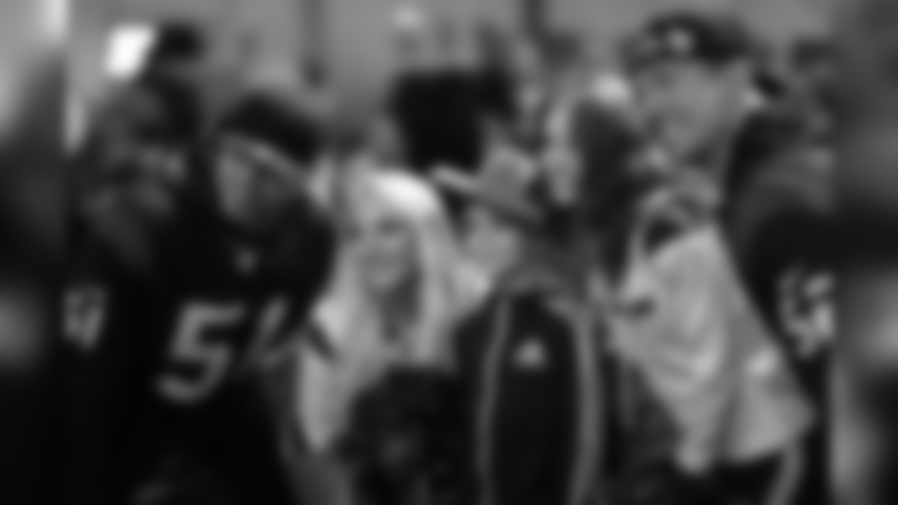 An image from the Feb. 27, 2019 community development event in which cheerleaders, Dylan Cole and Brian Peters attended the Houston Rodeo Military Appreciation BBQ.