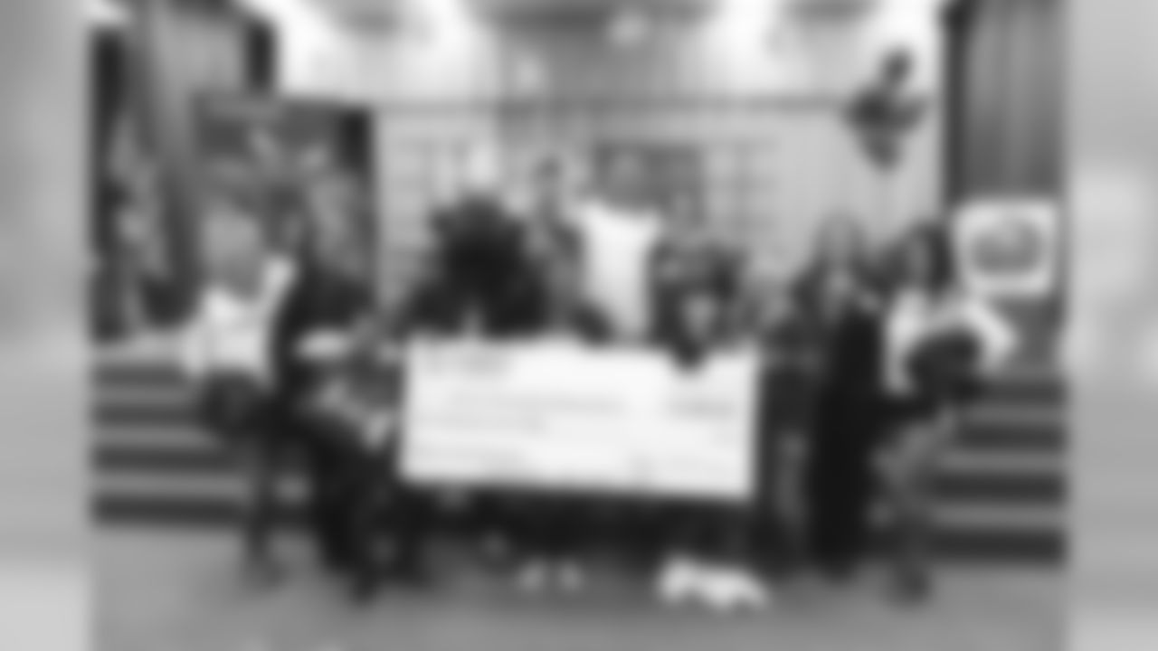 An image from the Nov. 13, 2018 corporate development event at Hirsch Elementary School in Spring, TX. Brian Peters, TORO, and cheerleaders visited the students and presented awards and a big check to teachers.