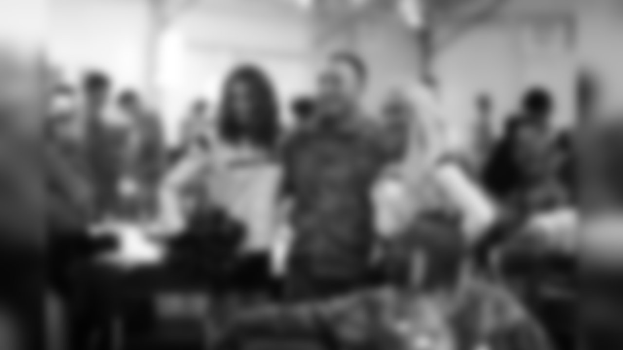 An image from the Feb. 27, 2019 community development event in which cheerleaders, Dylan Cole and Brian Peters attended the Houston Rodeo Military Appreciation BBQ.