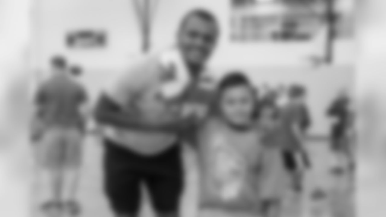 Houston Texans quarterback, Deshaun Watson, runs football drills with children at the Houston Texans YMCA on Thursday, June 14, 2018