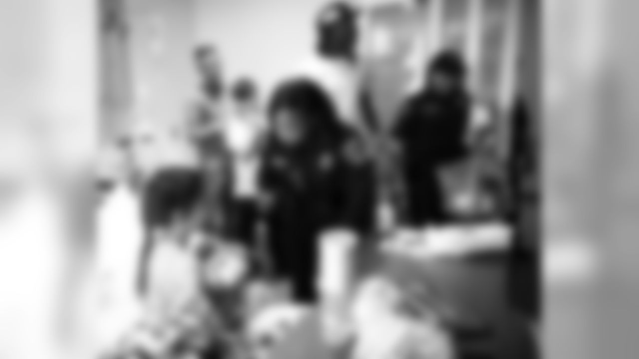 An image from the Oct. 30, 2018 community development event at Texas Children's Hospital. Players and police officers visited with hospital patients and making them honorary Òpolice officers for the dayÓ, gifting them with teddy bears.