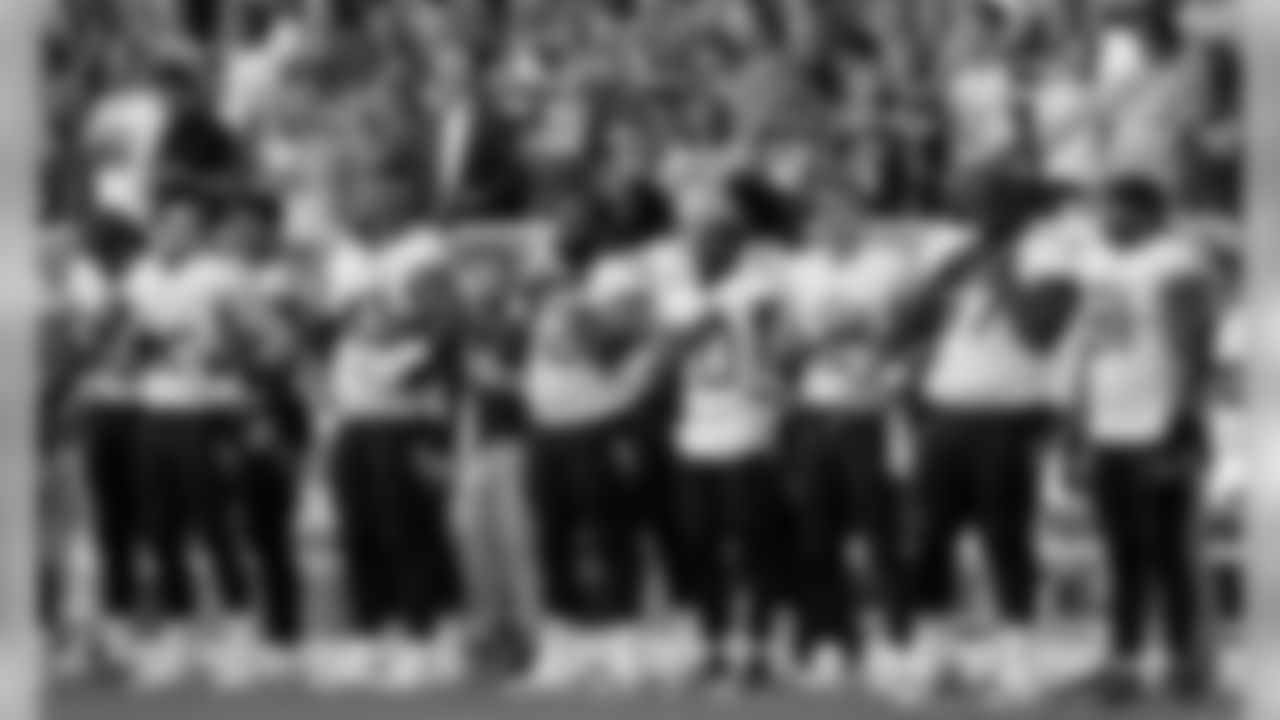 Tennessee Titans players line up for the national anthem before the first half of a preseason NFL football game against the Green Bay Packers Thursday, Aug. 9, 2018, in Green Bay, Wis. (AP Photo/Morry Gash)