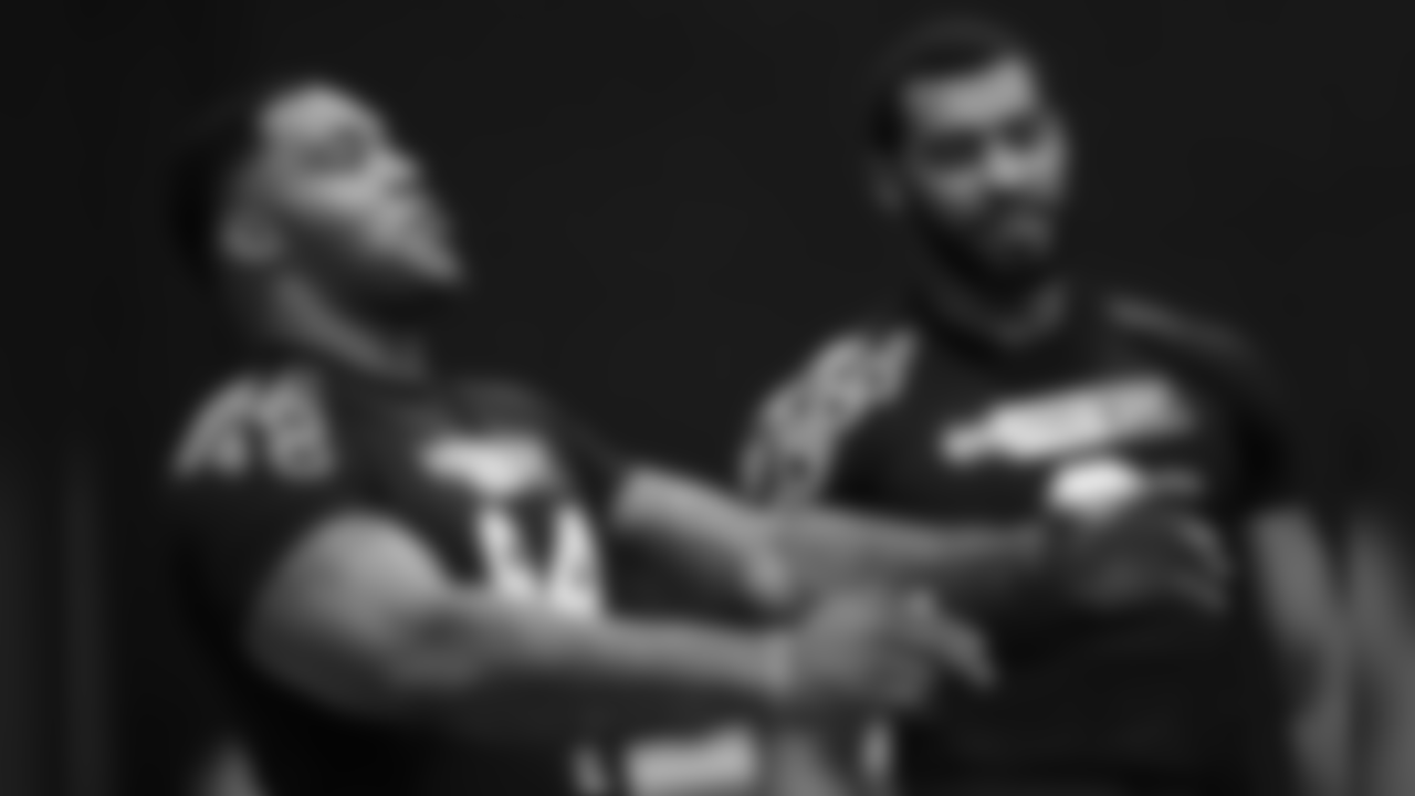 Former Mississippi State defensive players Jeffery Simmons, left, and Montez Sweat, joke around during Pro Day at the university, as other players were being tested by NFL football scouts and coaches, Wednesday, March 27, 2019, in Starkville, Miss. Sweat ran some agility drills, while Simmons stayed on the sidelines as he recovers from a leg injury. (AP Photo/Rogelio V. Solis)