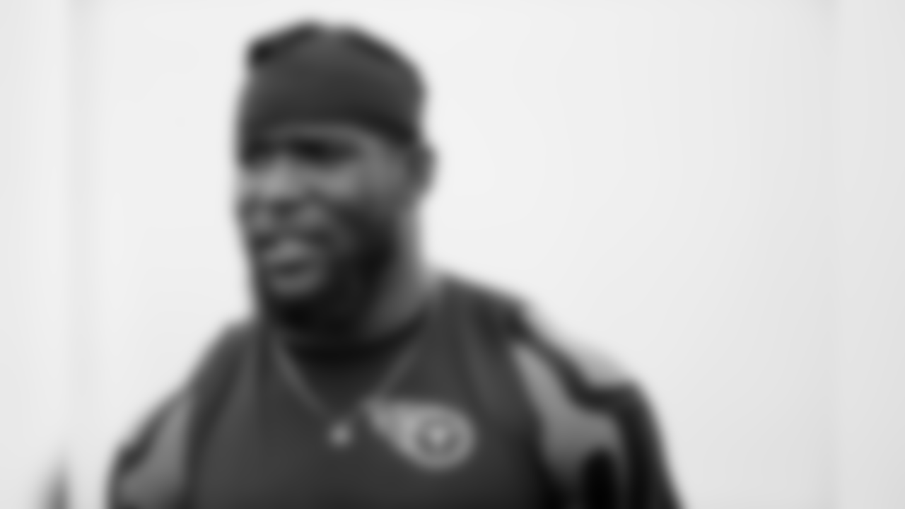 Tennessee Titans linebacker Brian Orakpo talks with friends after a practice at NFL football training camp Wednesday, Aug. 5, 2015, in Nashville, Tenn. (AP Photo/Mark Humphrey)