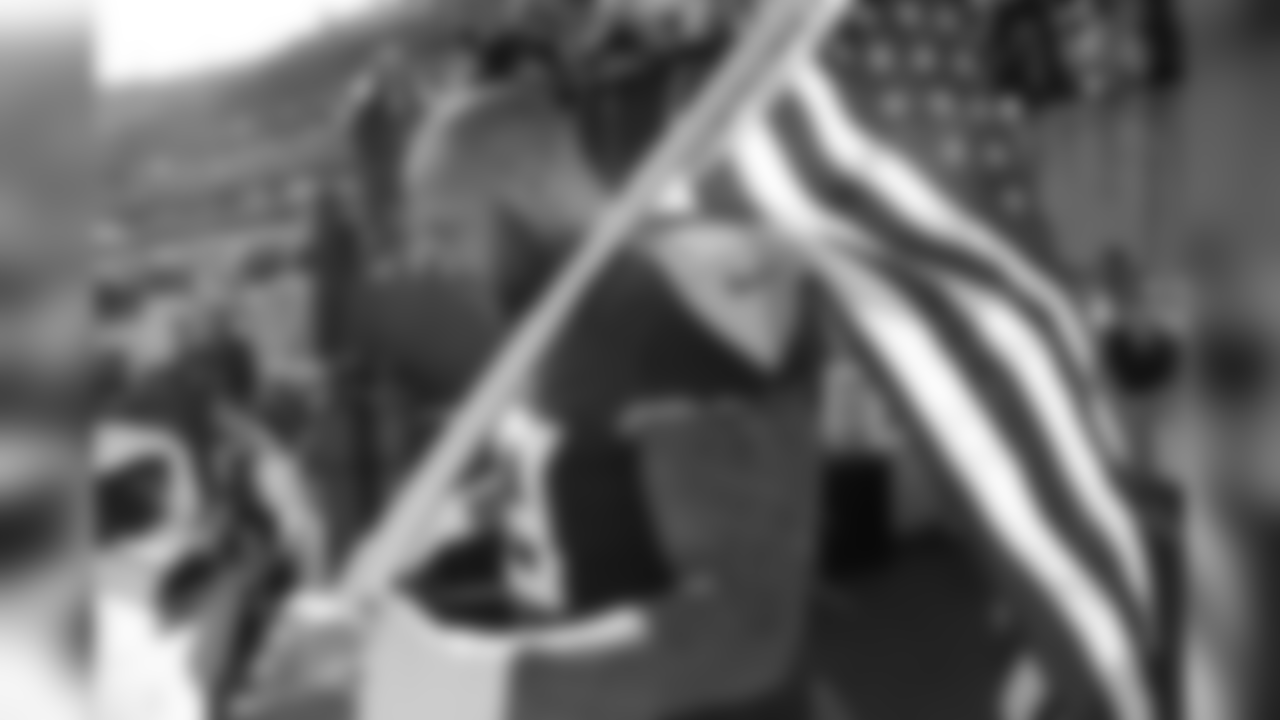 Tennessee Titans defensive end Jurrell Casey waits to carry an American flag onto the field before an NFL football game between the Titans and the New England Patriots Sunday, Nov. 11, 2018, in Nashville, Tenn. (AP Photo/James Kenney)
