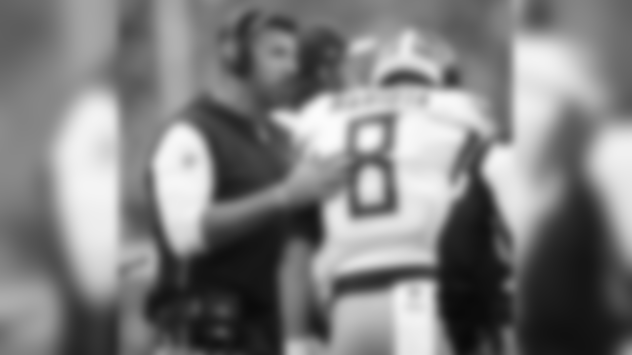 Tennessee Titans head coach Mike Vrabel, left, talks to quarterback Marcus Mariota during the first half of an NFL football game against the Buffalo Bills, Sunday, Oct. 7, 2018, in Orchard Park, N.Y. (AP Photo/Adrian Kraus)