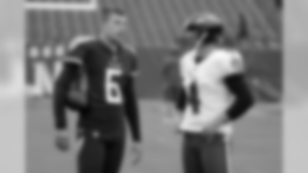 Tennessee Titans punter Brett Kern (6) talks with Baltimore Ravens punter Sam Koch (4) before an NFL football game Sunday, Oct. 14, 2018, in Nashville, Tenn. (AP Photo/James Kenney)
