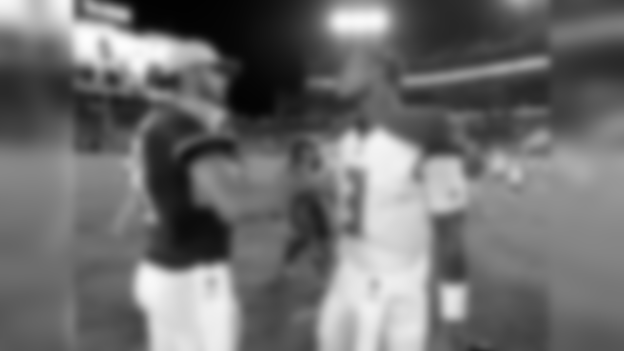 Tennessee Titans quarterback Marcus Mariota, left, meets with Tampa Bay Buccaneers quarterback Jameis Winston after a preseason NFL football game Saturday, Aug. 18, 2018, in Nashville, Tenn. The Buccaneers won 30-14. (AP Photo/Mark Zaleski)