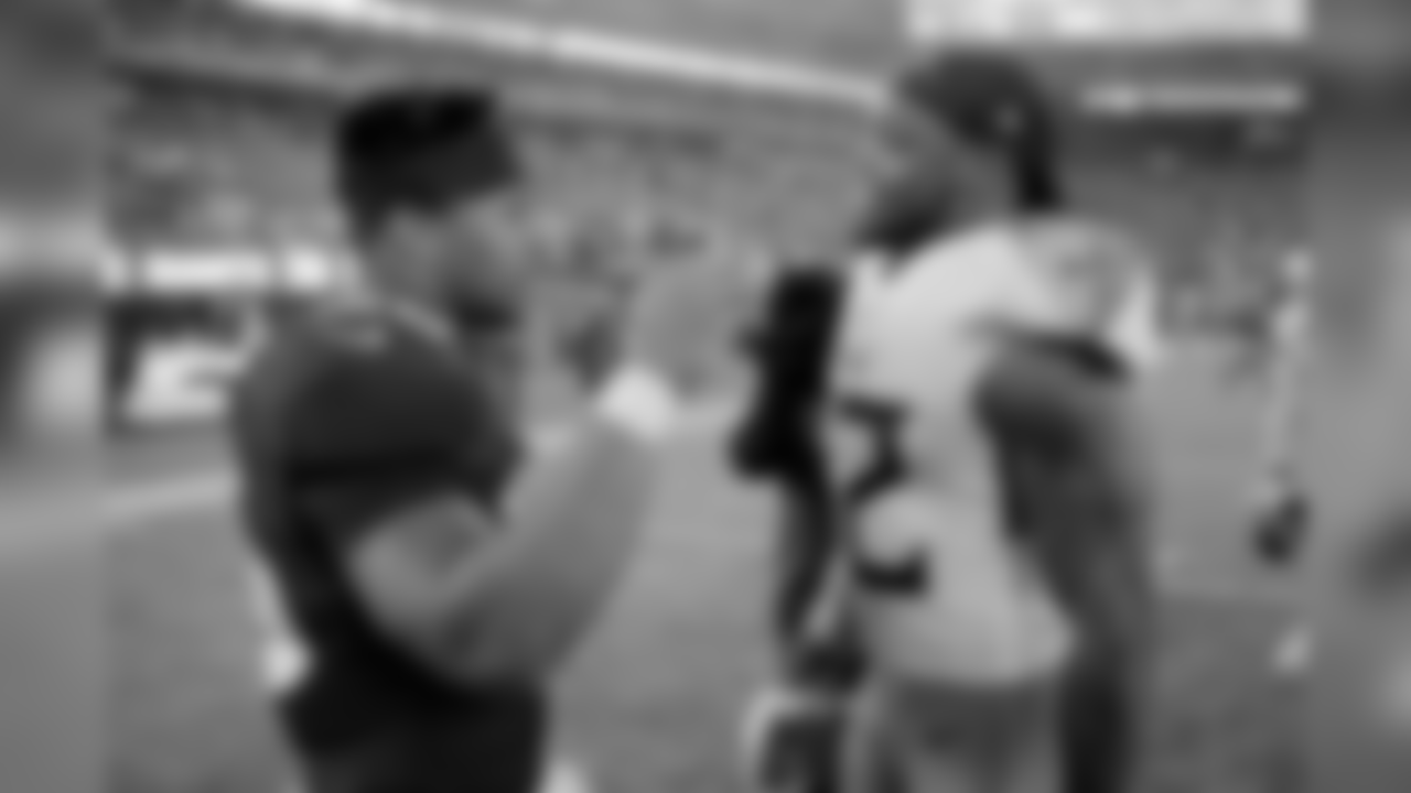 New York Giants running back Saquon Barkley, left, talks to Tennessee Titans running back Derrick Henry after an NFL football game, Sunday, Dec. 16, 2018, in East Rutherford, N.J. The Titans won 17-0. (AP Photo/Seth Wenig)