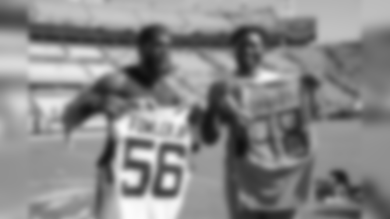 Tennessee Titans linebacker Brian Orakpo, left, and Jacksonville Jaguars defensive end Dante Fowler trade jerseys on the field after an NFL football game Sunday, Sept. 23, 2018, in Jacksonville, Fla. The Titans won 9-6. (AP Photo/Phelan M. Ebenhack)