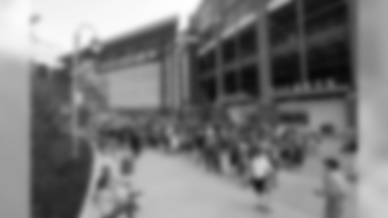 Fans line up outside Lambeau Field before a preseason NFL football game between the Green Bay Packers and the Tennessee Titans Thursday, Aug. 9, 2018, in Green Bay, Wis. (AP Photo/Matt Ludtke)