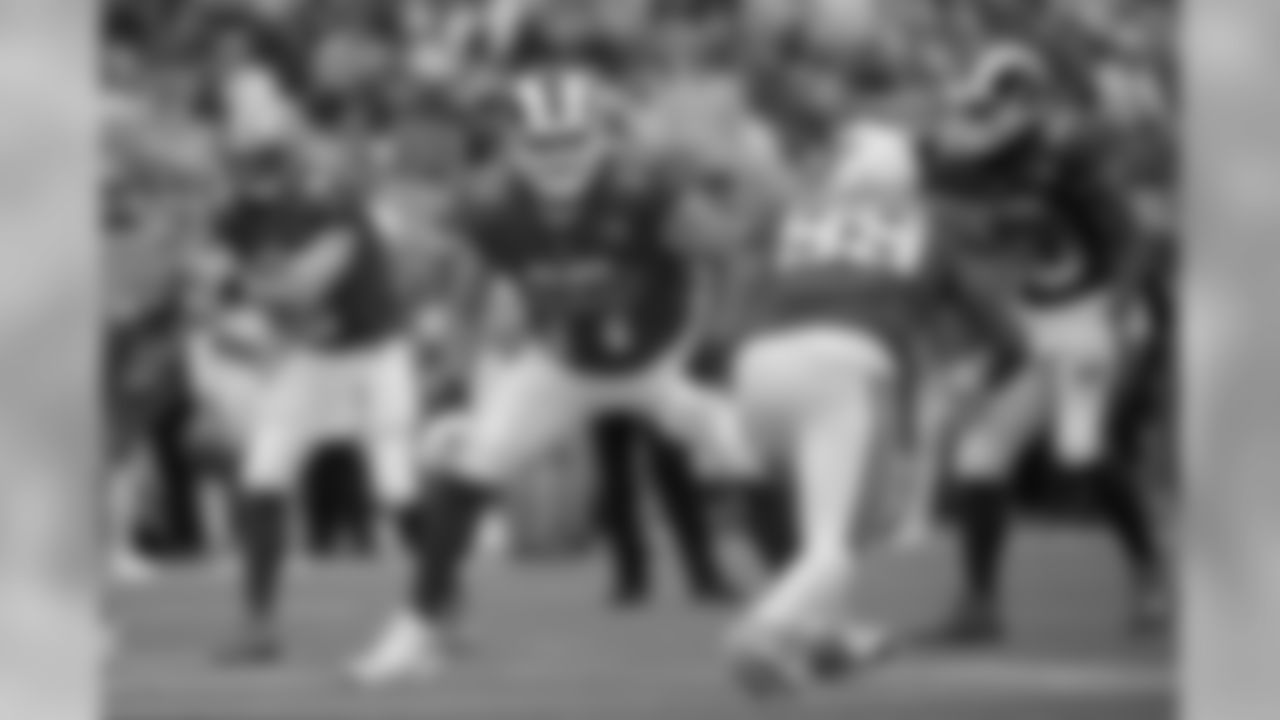 NFC offensive tackle Andrew Whitworth (77), of the Los Angeles Rams, and running back Todd Gurley (30), of the Los Angeles Rams set up against AFC defensive tackle Jurrell Casey (99), of the Tennessee Titans, during the first half of NFL Pro Bowl football game Sunday, Jan. 28, 2018, in Orlando, Fla. The AFC won 24-23. (AP Photo/Phelan M. Ebenhack)