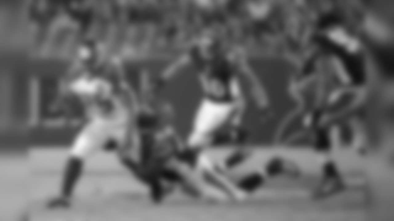 Tampa Bay Buccaneers running back Mike James (25) rushes for yardage in front of Cincinnati Bengals defensive tackle DeShawn Williams (69), free safety Derron Smith (40) and defensive end Will Clarke (93) during the second half of a preseason NFL football game in Tampa, Fla., Monday, Aug. 24, 2015. (AP Photo/Phelan M. Ebenhack)