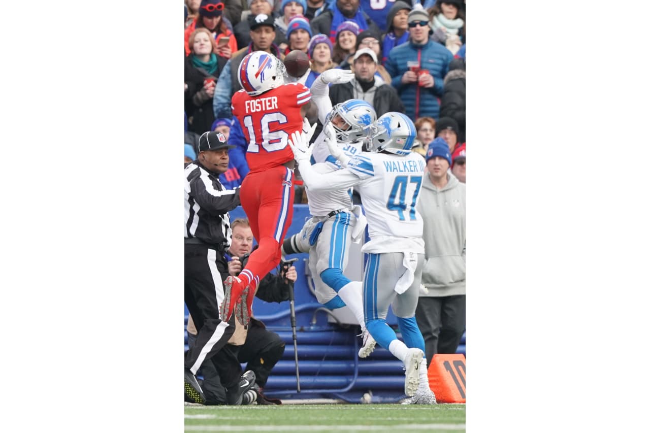 Buffalo Bills wide receiver Robert Foster (16) goes up for a a catch against Detroit Lions defensive back Mike Ford (38) and defensive back Tracy Walker (47).    Buffalo Bills vs Detroit Lions at New Era Field on December 16, 2018.     Photo by Craig Melvin