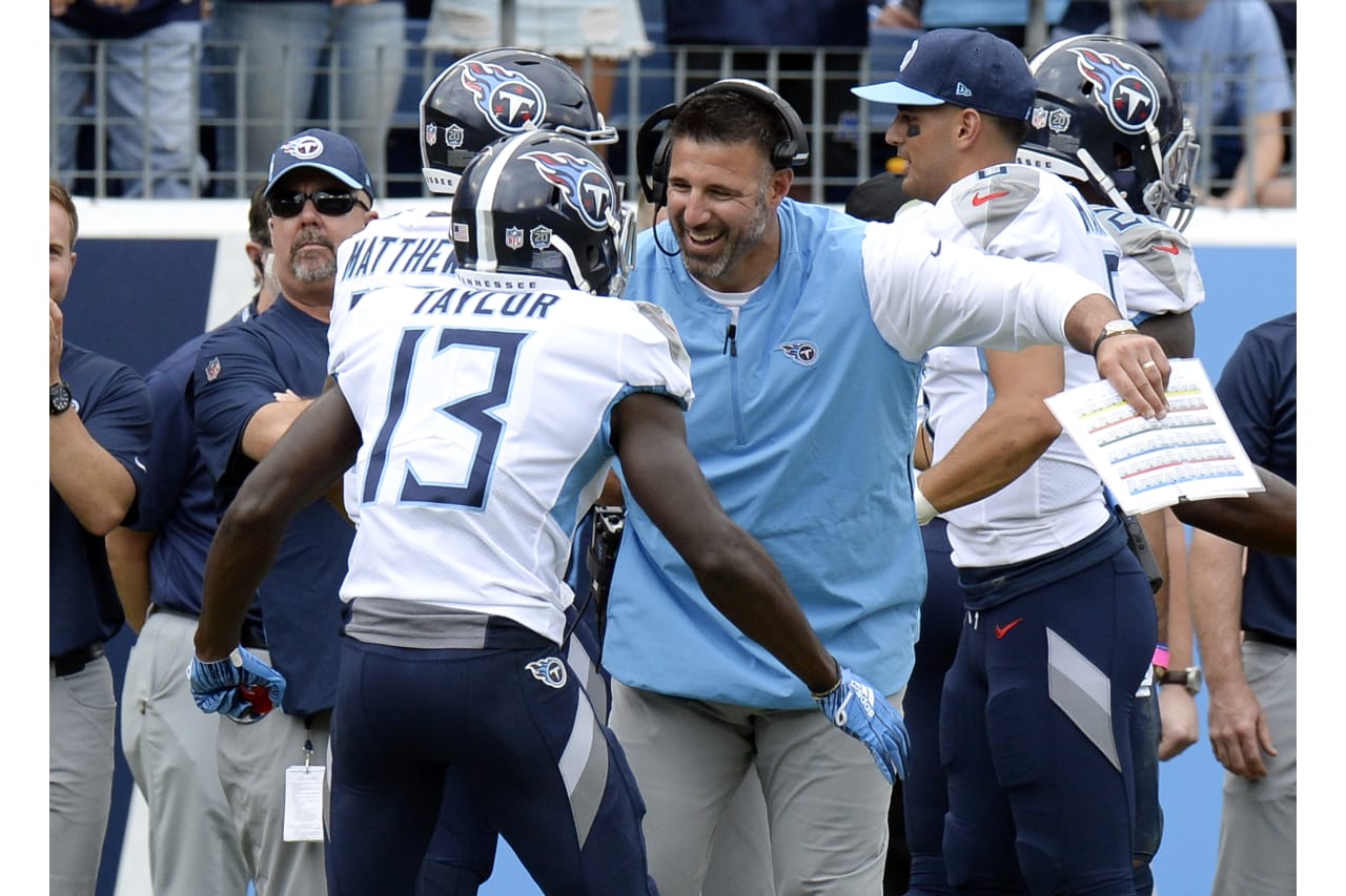 Tennessee Titans head coach Mike Vrabel celebrates with wide receiver Taywan Taylor (13) after Taylor scored a touchdown against the Houston Texans in the first half of an NFL football game Sunday, Sept. 16, 2018, in Nashville, Tenn. (AP Photo/Mark Zaleski)