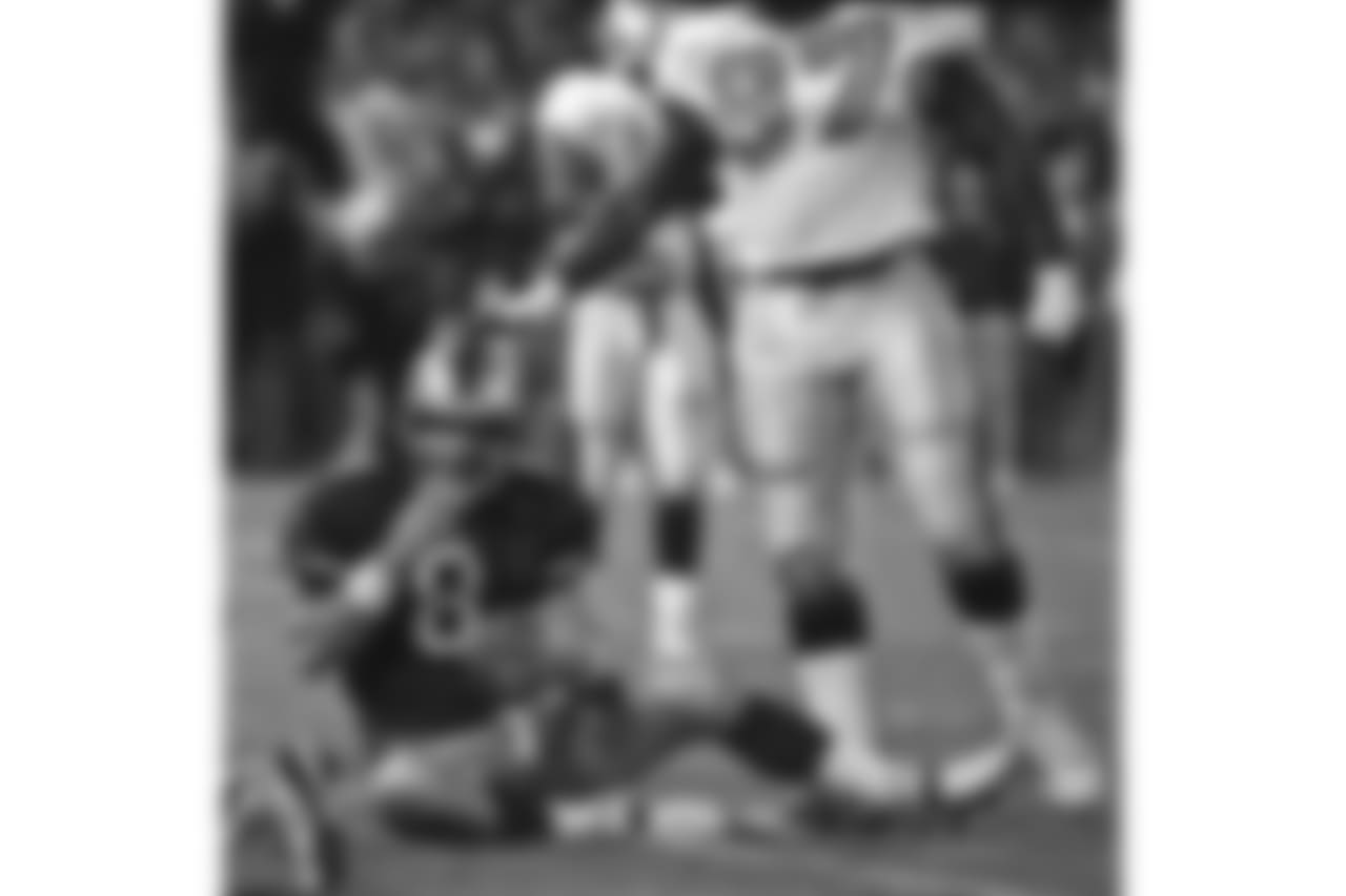 1998 -- 49ers quarterback Steve Young and Saints pass-rusher La'Roi Glover.