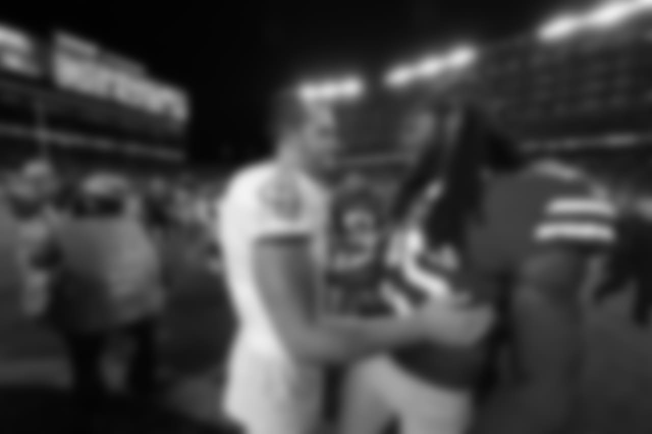 CB Richard Sherman and Raiders QB Derek Carr