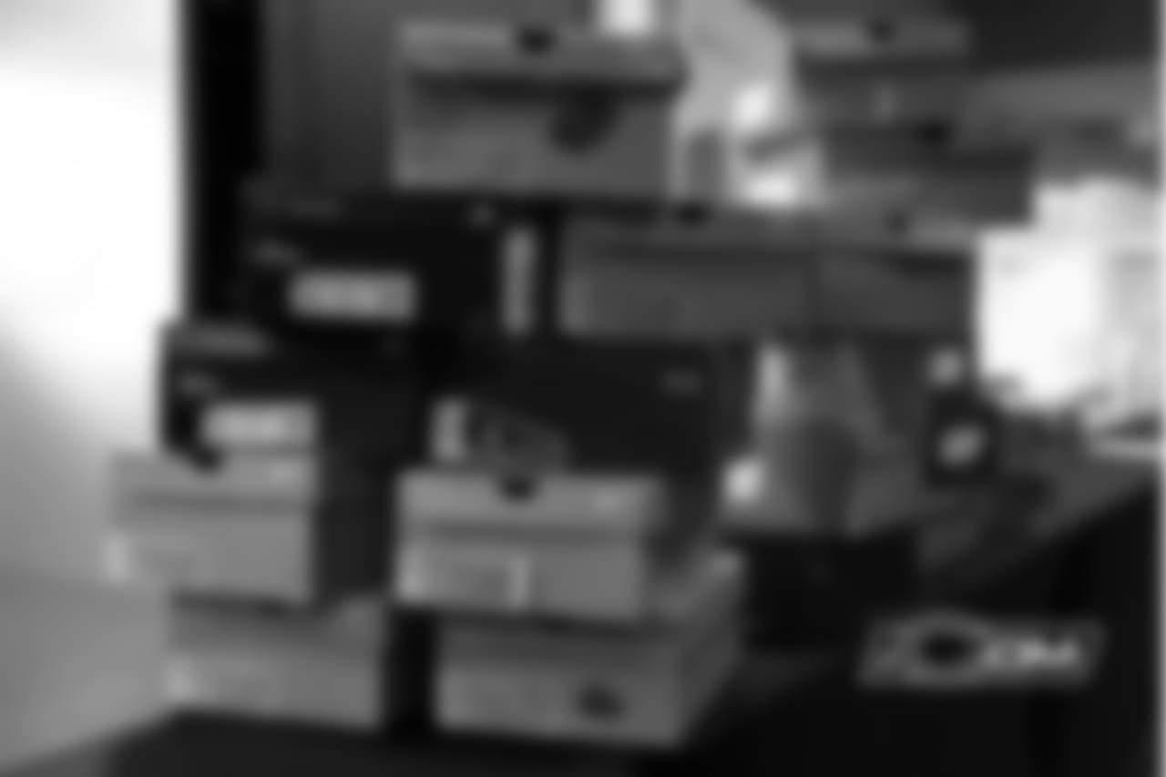A stack of cleats are boxed back up and taken to the equipment room to be broken in before Sunday's game.