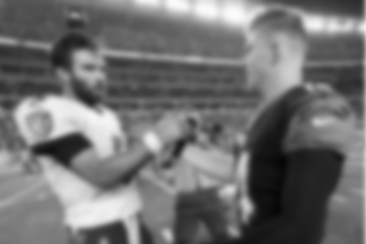 Baltimore Ravens quarterback Joe Flacco (5) and Cincinnati Bengals quarterback Andy Dalton (14) meet on the field after an NFL football game, Thursday, Sept. 13, 2018, in Cincinnati. Bengals won 34-23. (AP Photo/Frank Victores)