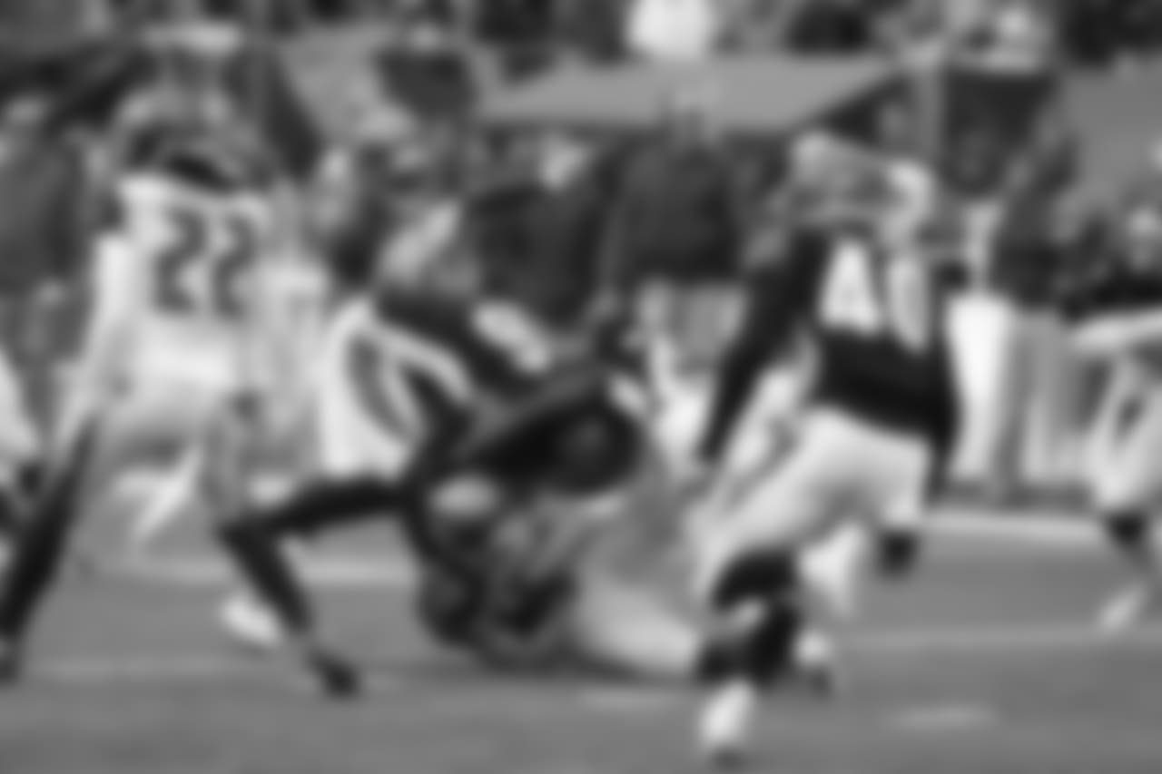 Cody Core and Tony McRae make a tackle in kickoff coverage against Tampa Bay.