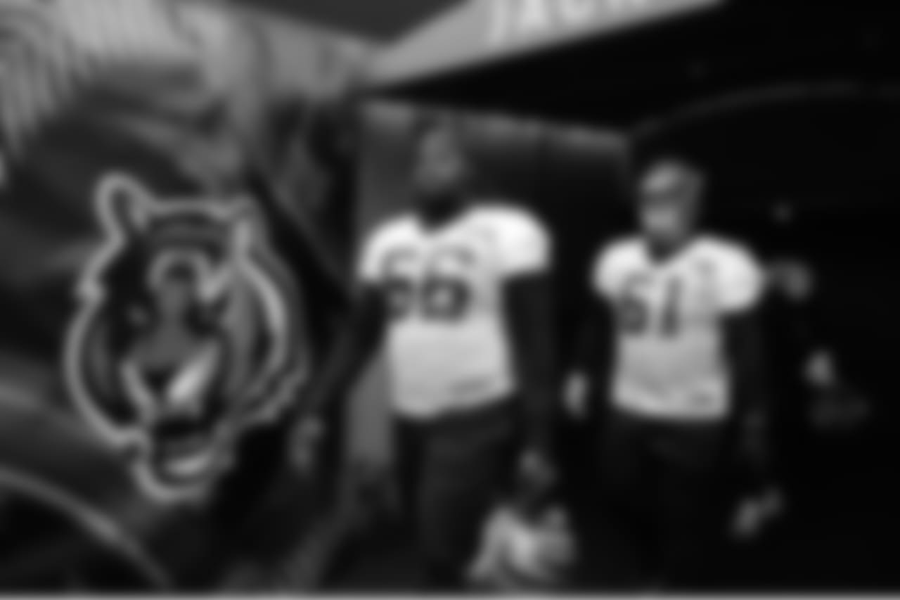 Trey Hopkins and Brad Lundblade enter Paul Brown Stadium for practice.