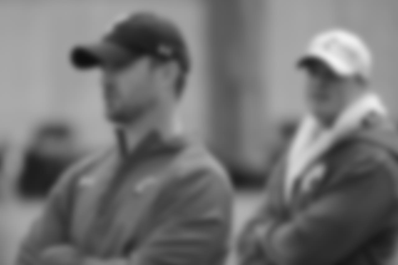 Cincinnati's offensive coordinator and quarterbacks coach Zac Taylor, left, works the sidelines alongside Gunner Kiel, right, during their spring NCAA college football game, Saturday, April 2, 2016, in Cincinnati. Taylor, the former offensive coordinator of the Miami Dolphins, was hired earlier this year to replace the vacant positions left by former UC offensive coordinator Eddie Gran and former UC quarterbacks coach Darin Hinshaw. (AP Photo/John Minchillo)