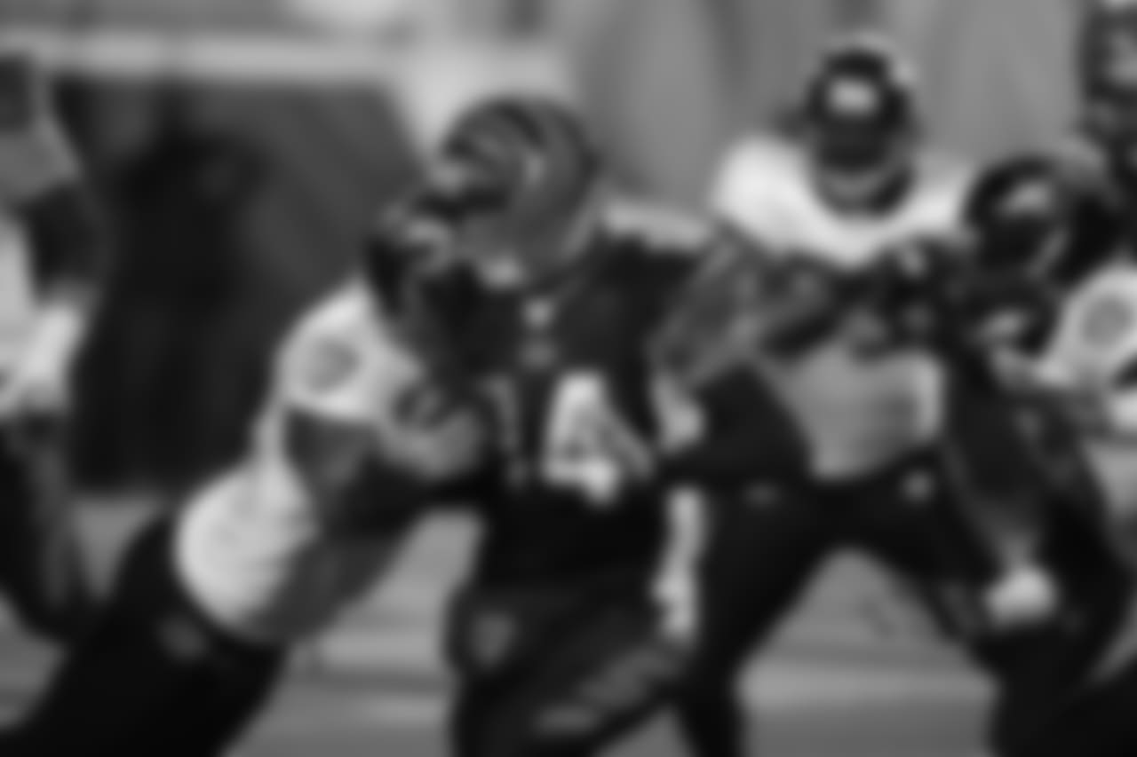 Andy Dalton charges ahead for a first down in a 2011 game against Baltimore.