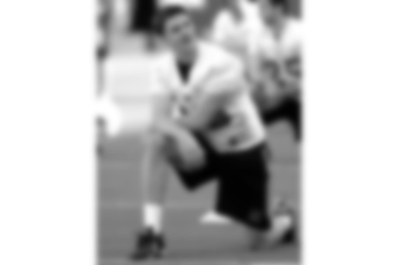 ** FILE ** Quarterback Zac Taylor, a junior-college transfer, stretches during the opening day of Nebraska's spring drills at Memorial Stadium in Lincoln, Neb., March 23, 2005. Taylor is challenging Joe Dailey, last year's starter, for the no. 1 position this spring. (AP Photo/Bill Wolf)