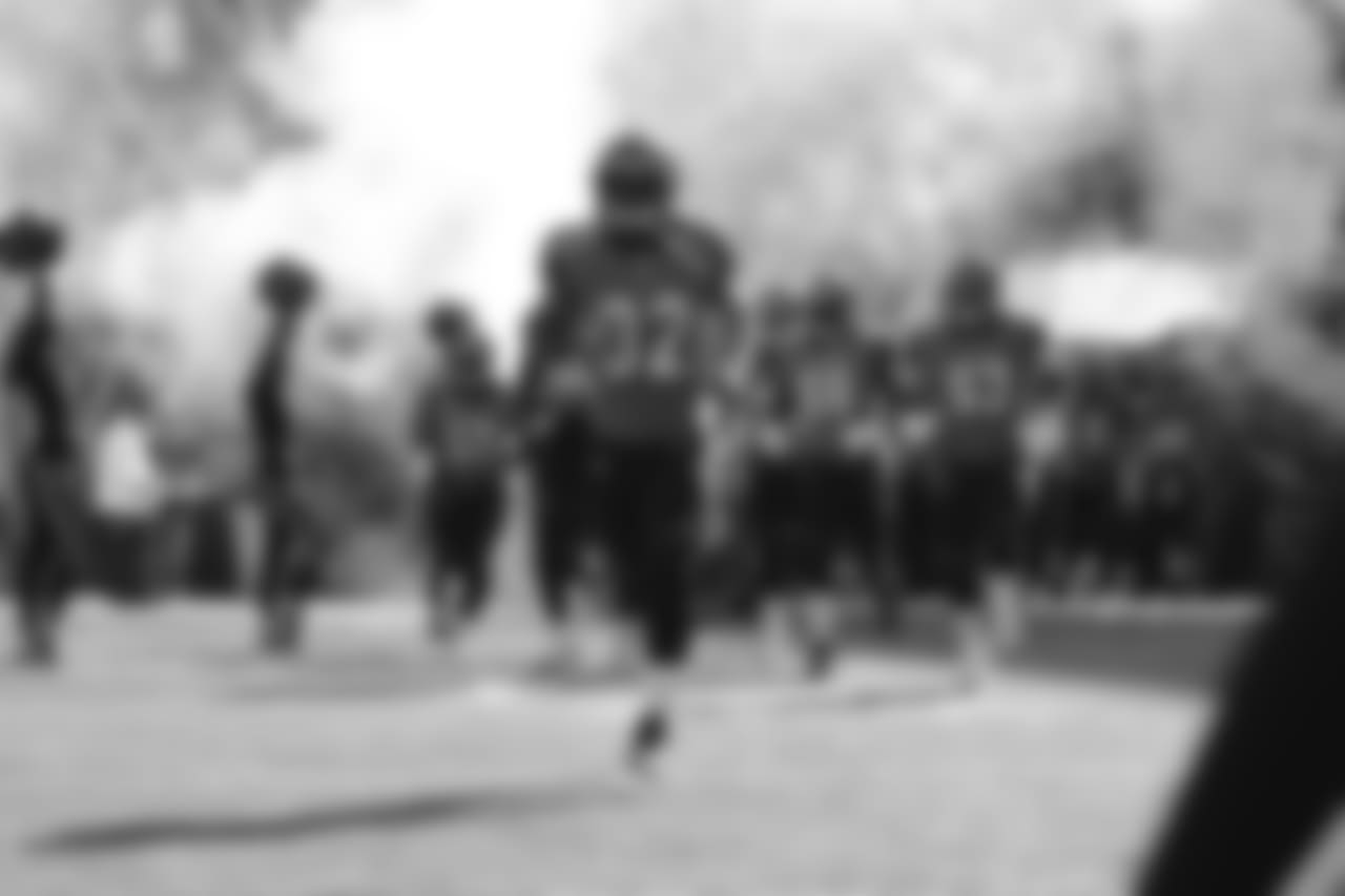 The Bengals run out onto the field before the game against the New Orleans Saints.