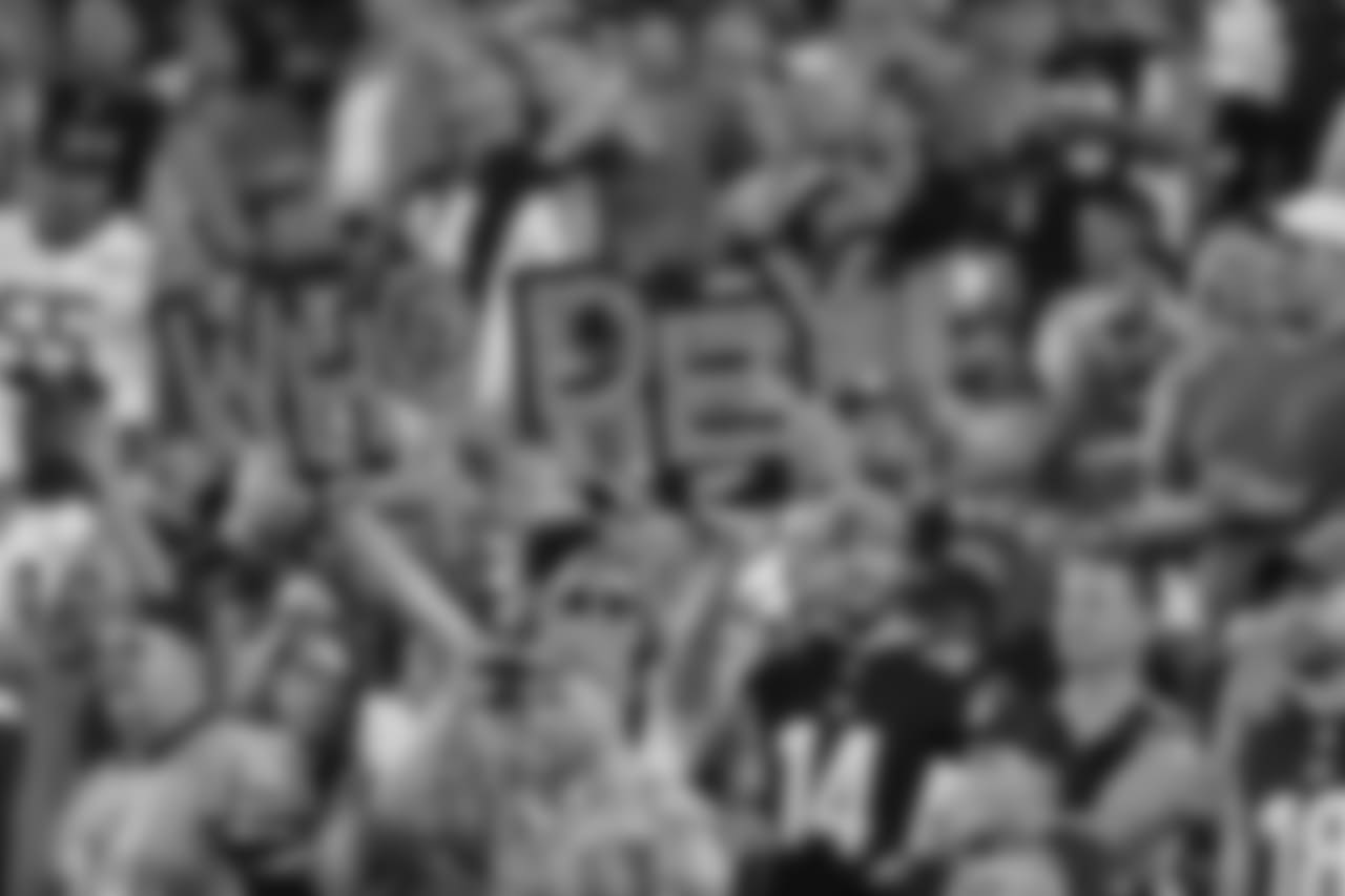 During opening night, a fans holds a Who Dey sign before a game against the Baltimore Ravens.