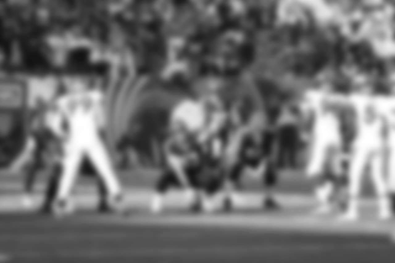 Center Billy Price points out the defensive alignment before snapping the ball.