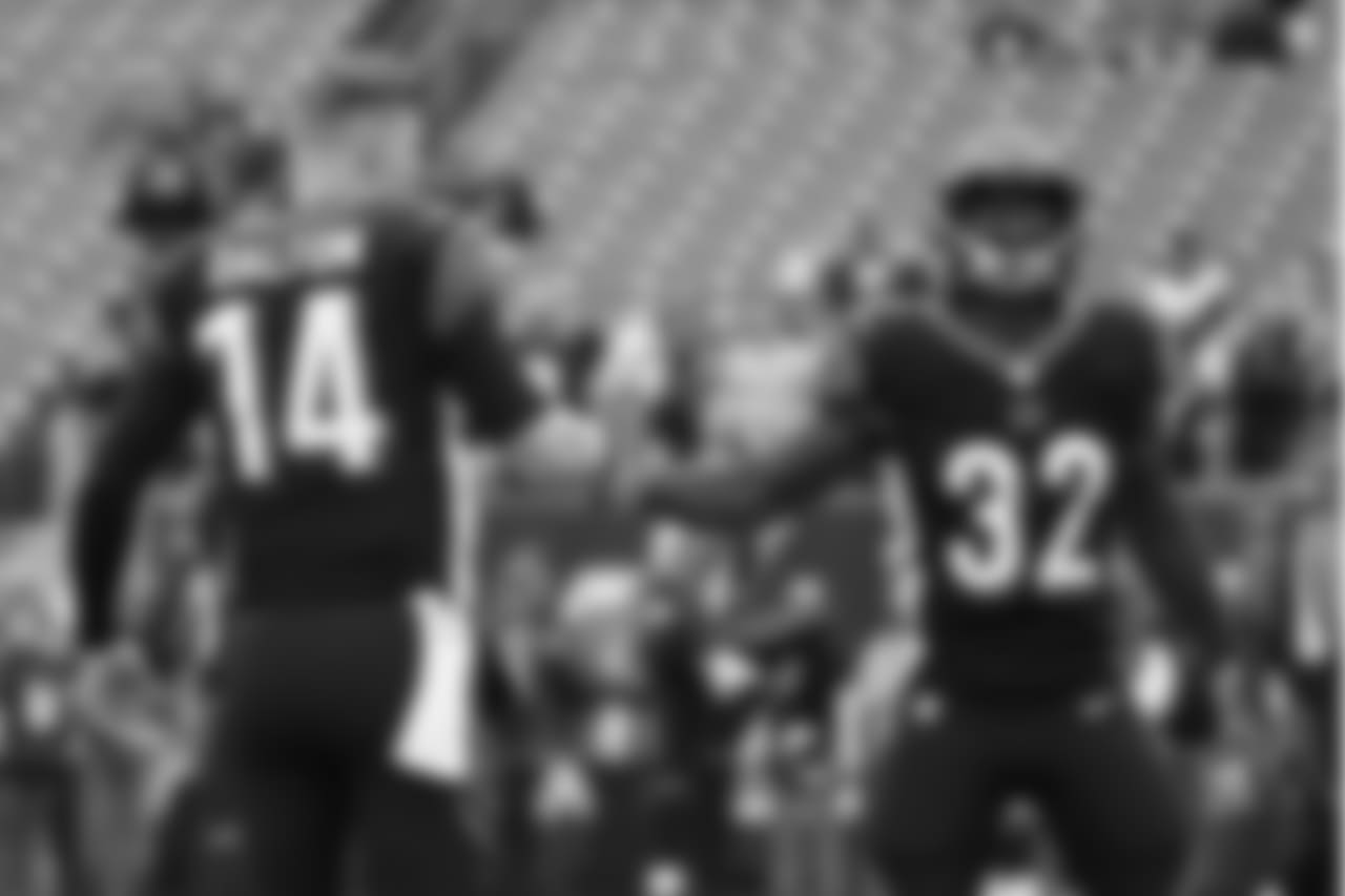 Cincinnati Bengals quarterback Andy Dalton (14) and running back Mark Walton (32) practice before an NFL football game against the Pittsburgh Steelers, Sunday, Oct. 14, 2018, in Cincinnati. (AP Photo/Frank Victores)