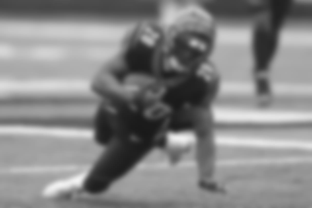 Joe Mixon dives for a first down in a game against the Pittsburgh Steelers.