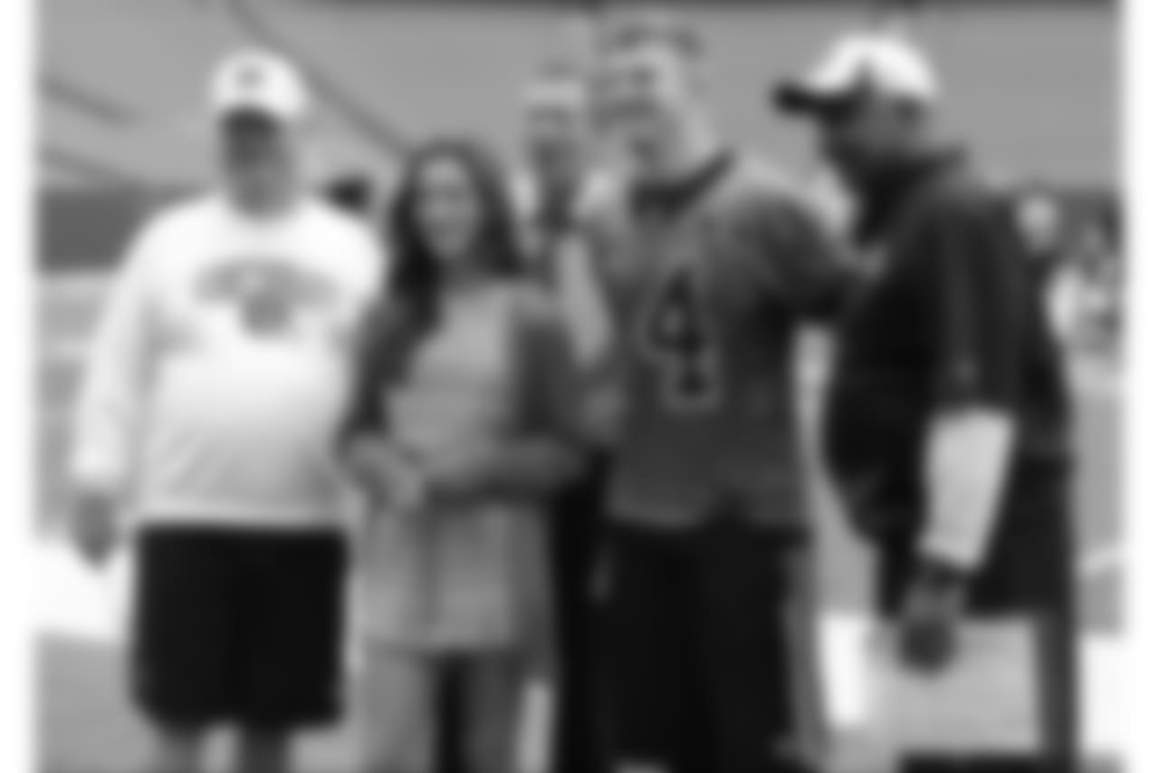 Posing for a photo during Cincinnati Bengals practice at an NFL football mandatory minicamp are, left to right, Bengals president Mike Brown, Reese Kasich, Ohio Gov. John Kasich, quarterback Andy Dalton, and head coach Marvin Lewis, Wednesday, June 11, 2014, in Cincinnati. (AP Photo/Al Behrman)