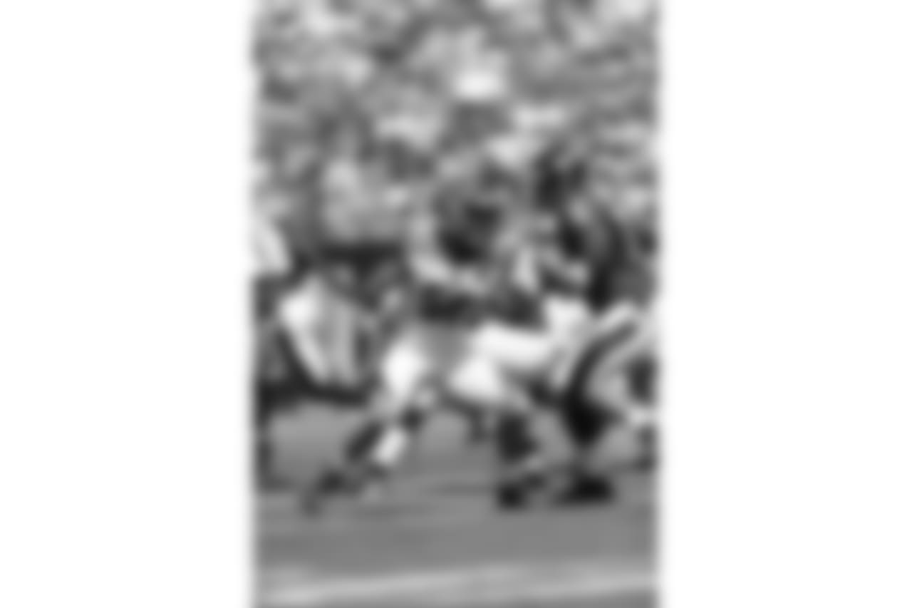 Carl Lawson rushes the passer in a game against Baltimore in 2017.