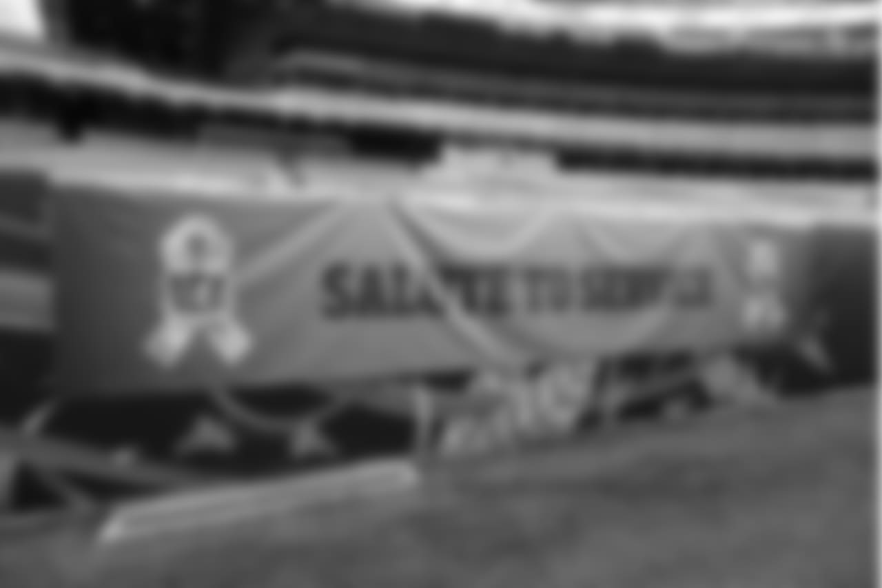A Salute to Service banner hangs at Paul Brown Stadium before an NFL football game between the Cincinnati Bengals and the New Orleans Saints, Sunday, Nov. 11, 2018, in Cincinnati. (AP Photo/Frank Victores)