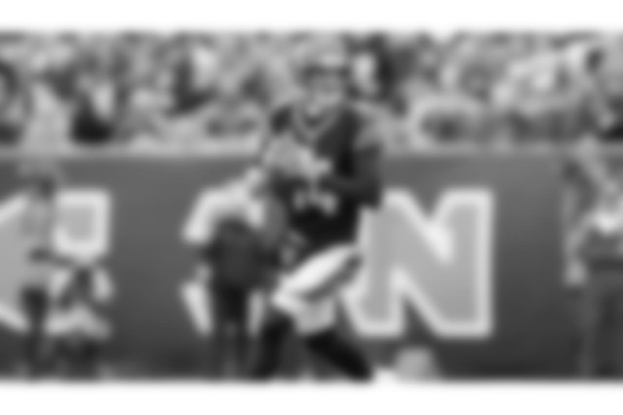 Andy Dalton rolls out to pass in a game against the Tampa Bay Buccaneers.