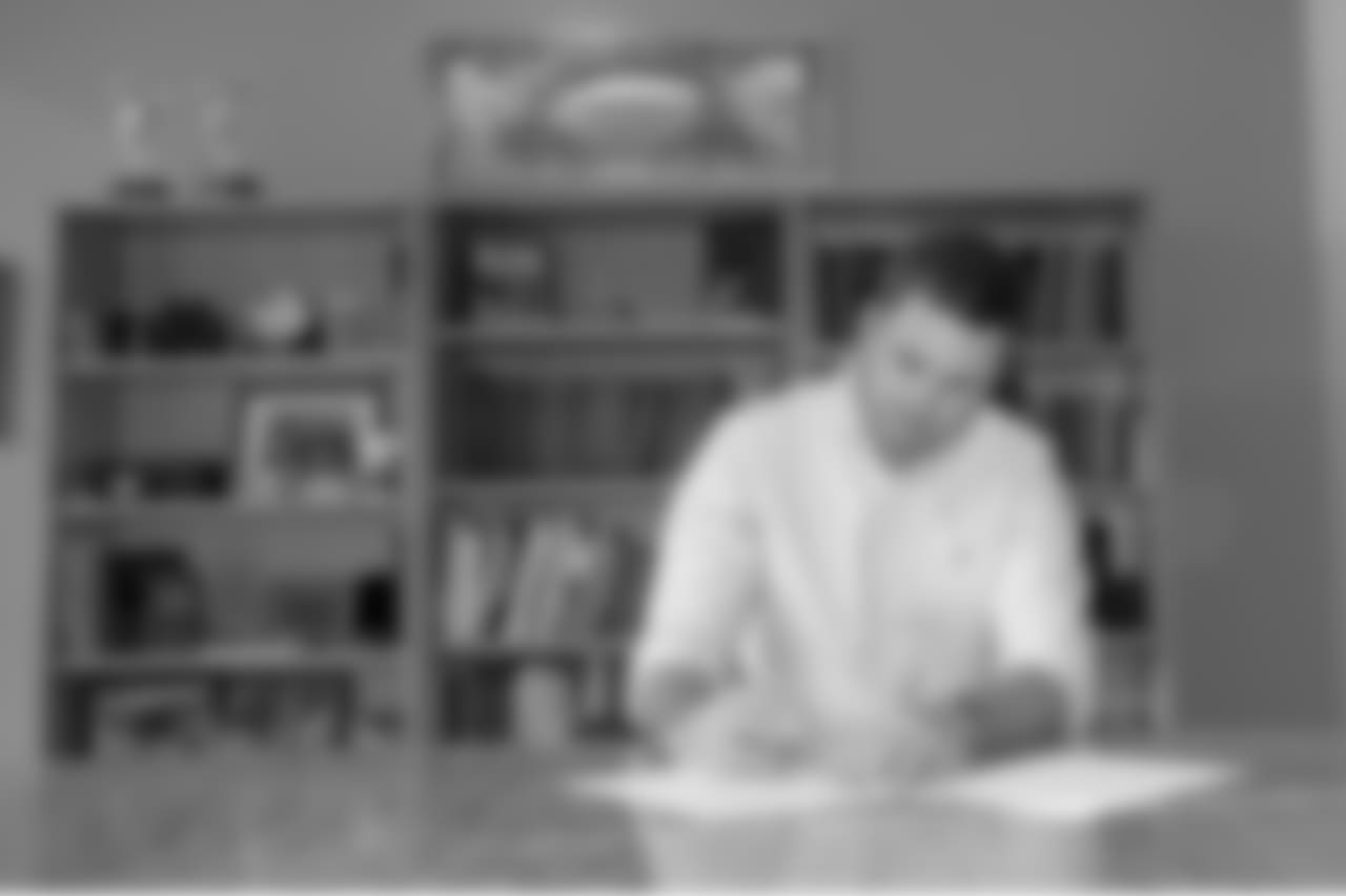 Zac Taylor signs his contract to become the 10th head coach in franchise history.