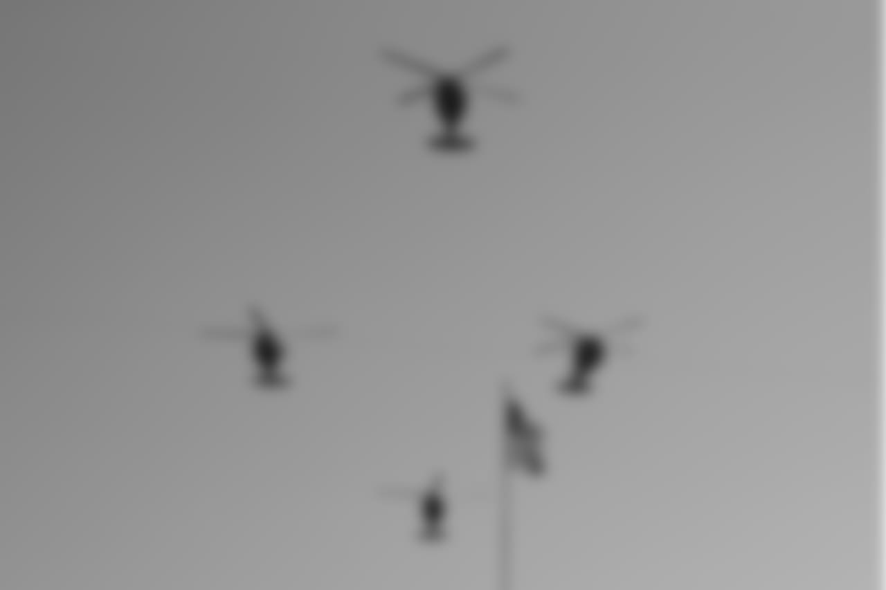 Military helicopters fly over Paul Brown Stadium before an NFL football game between the Cincinnati Bengals and the New Orleans Saints, Sunday, Nov. 11, 2018, in Cincinnati. (AP Photo/Gary Landers)