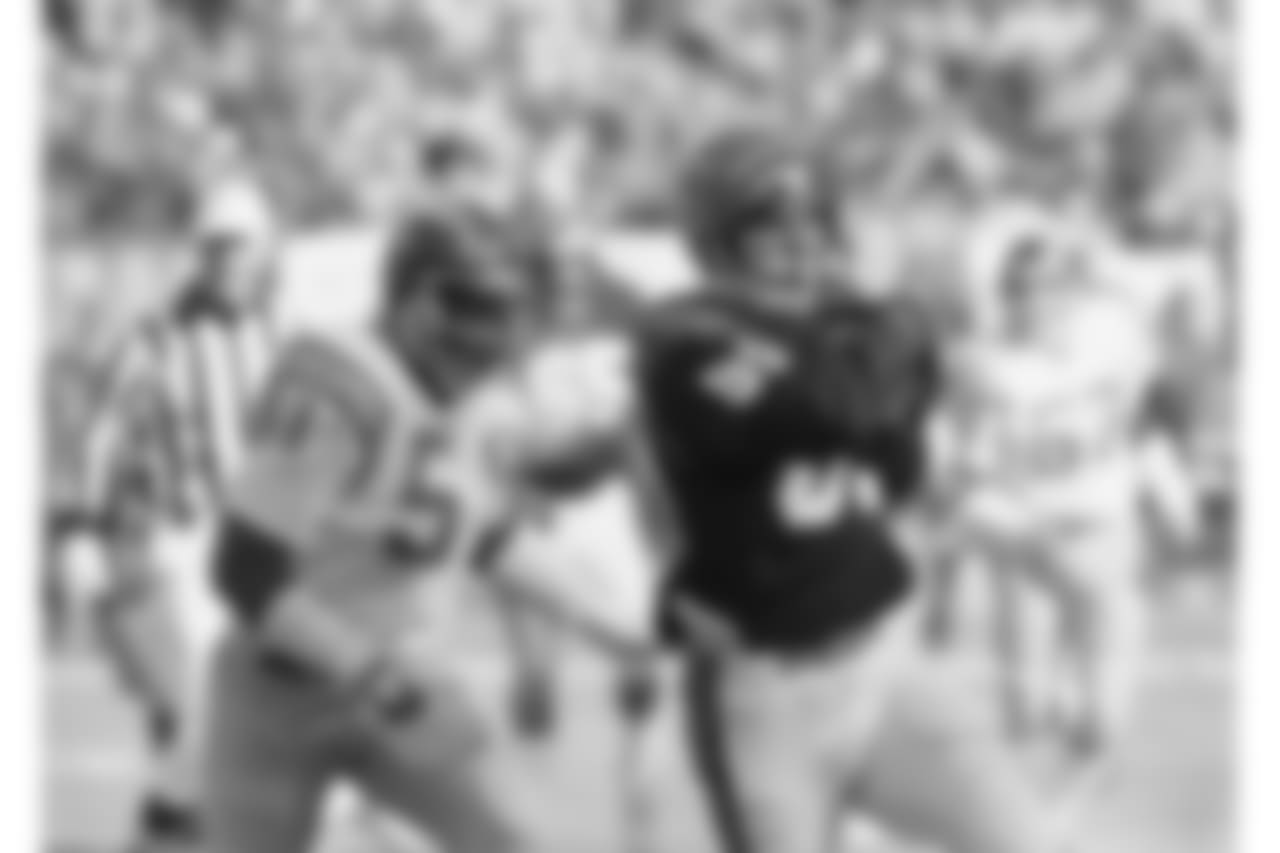 Cincinnati Bengals tight end Dan Ross drives for yardage after a pass reception from Bengals quarterback Ken Andersen during the AFC Championship game against the San Diego chargers, Sunday, Jan. 10, 1982, Cincinnati, Oh. Chargers linebacker Woodrow Lowe makes the stop during first half action. (AP Photo)