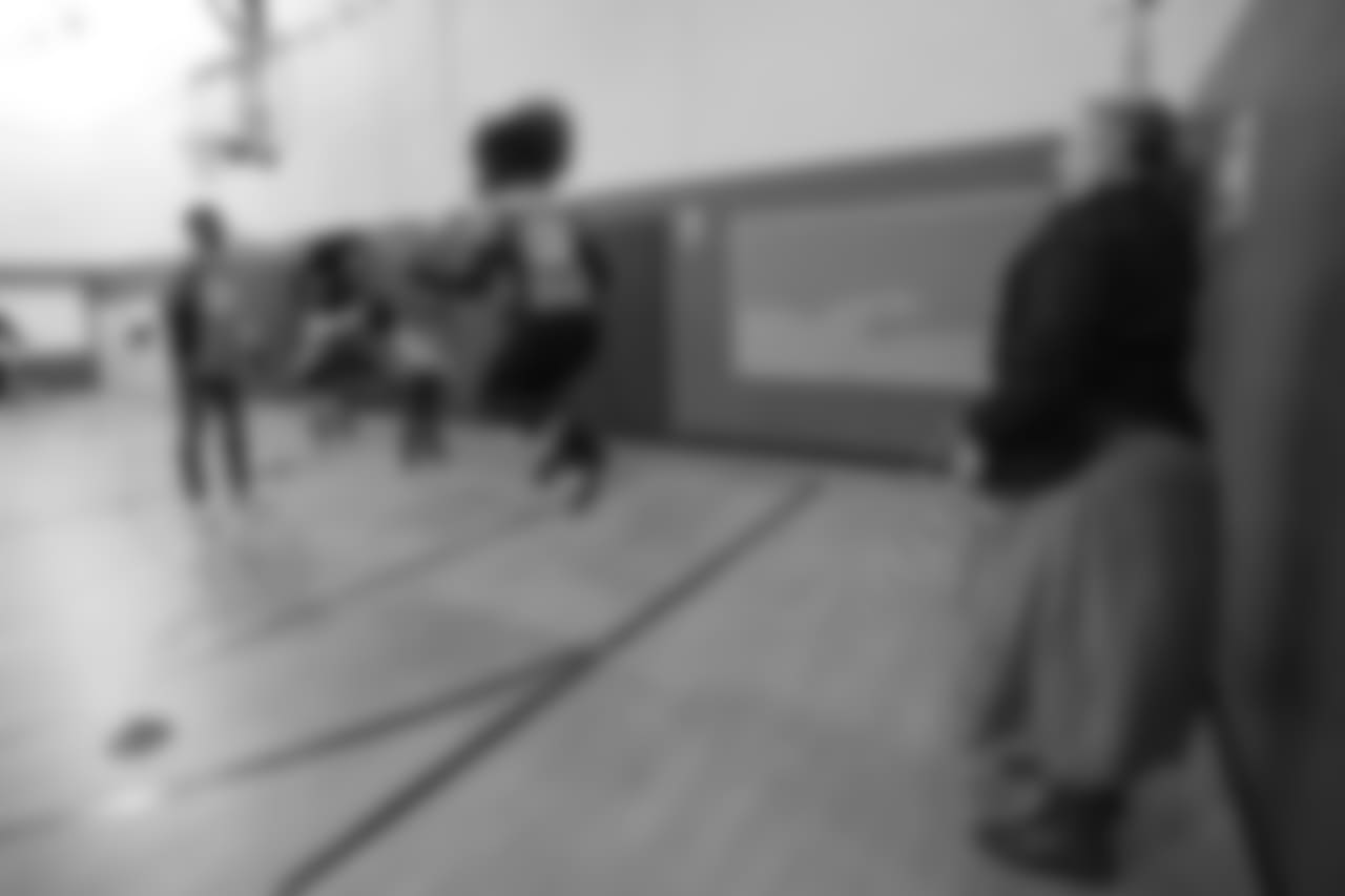 DBC Breanna jumps rope as Demaryius Thomas swings the rope at a Playworks recess visit (alongside CarMax volunteers) with first-, second- and third-grade students at Greenwood Academy on October 9, 2018.