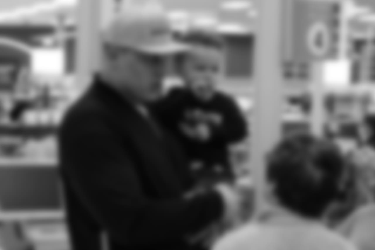 Garett Bolles and his son, Kingston, during Will Parks' shopping spree for the Boys & Girls Club of Metro Denver on Dec. 3, 2018