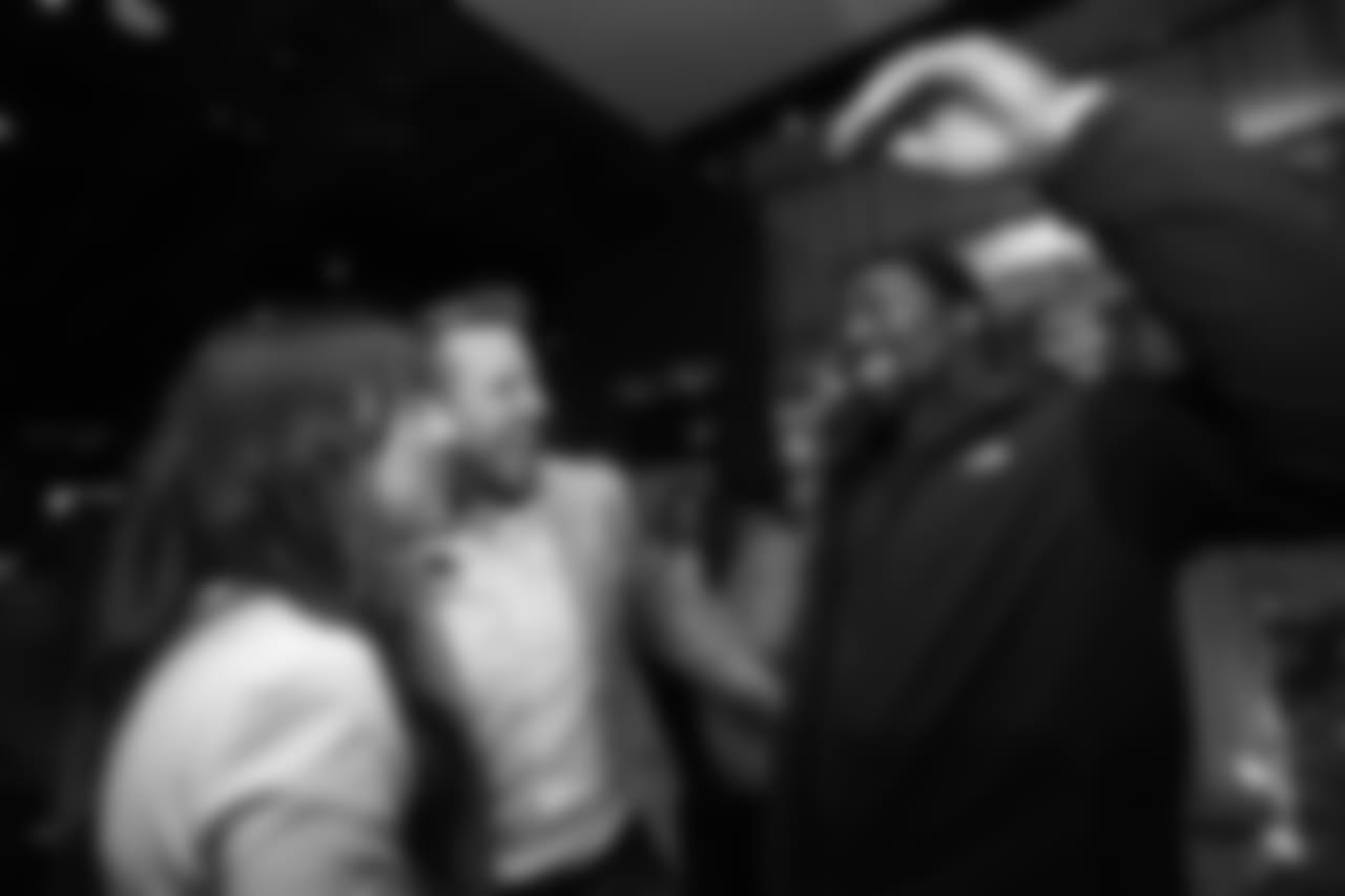 Kimberly and Case Keenum greet Shelby Harris at Todd Davis' A+ Living Foundation Dinner on November 26, 2018.