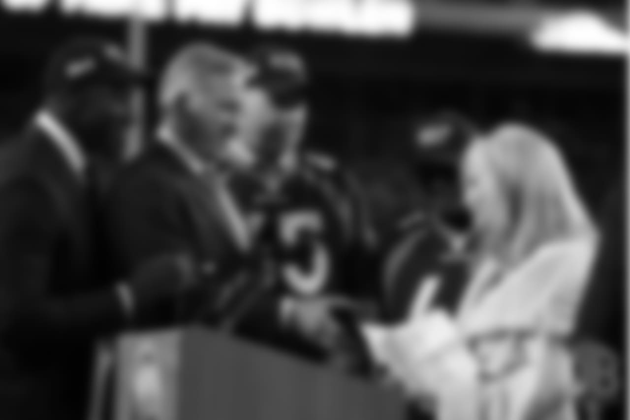 Broncos Hall of Famers Shannon Sharpe, John Elway, Gary Zimmerman and Floyd Little congratulate Annabel Bowlen after her speech during Ring of Fame induction ceremonies for her husband, Broncos Owner Pat Bowlen, on Nov. 1, 2015.