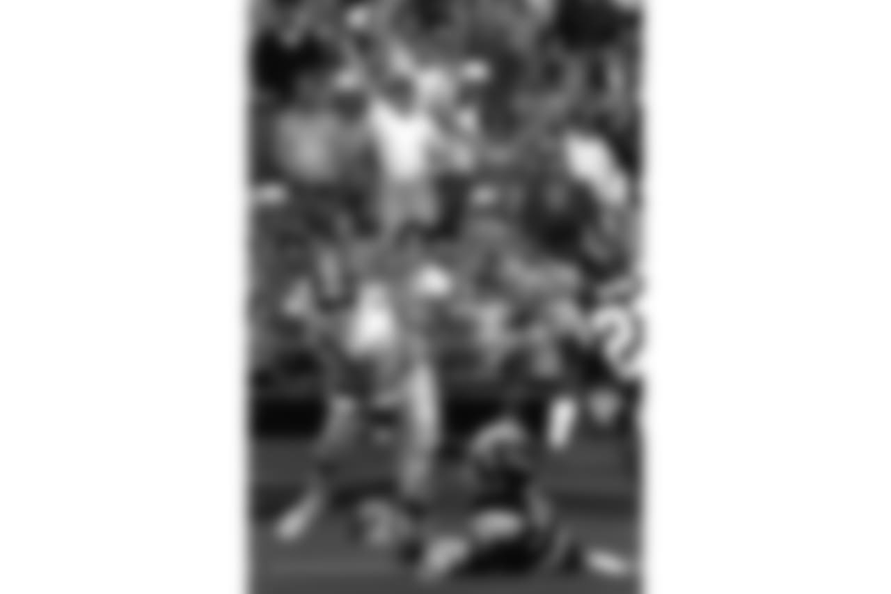 Wide receiver Steve Watson runs over a Charger defender during an Oct. 12, 1986, win (31-14) in San Diego.
